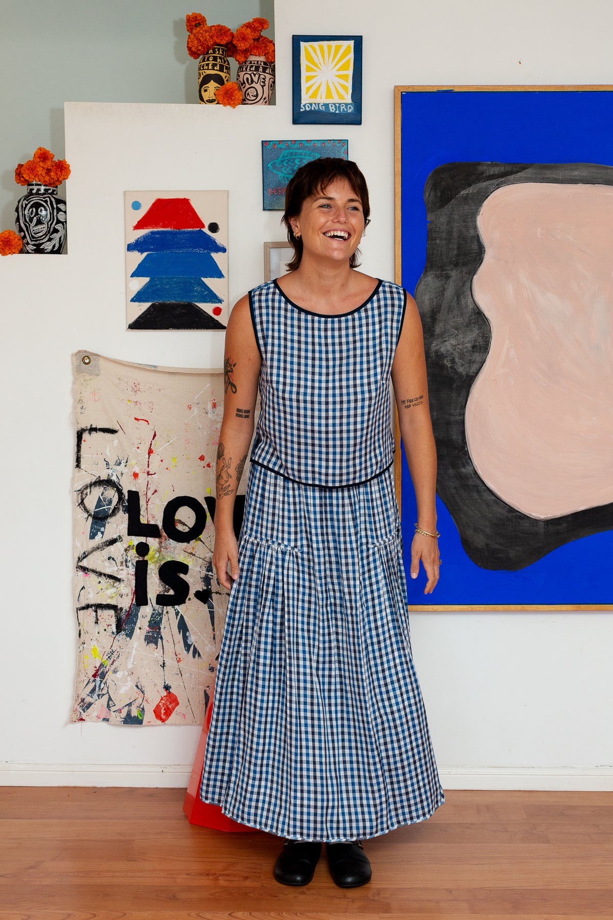 Muse wears Asta Skirt by Little Tienda paired with Nova Blouse in the Blue and Black Check